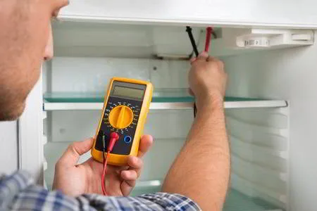 Sparkle Appliance Freezer Technician Fixing Freezer With Digital Multimeter