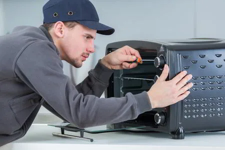 Sparkle Appliance Repairman Fixing Microwave Not Heating