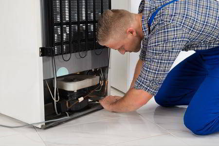 Sparkle Appliance Repairman Working On Portland Freezer Repair