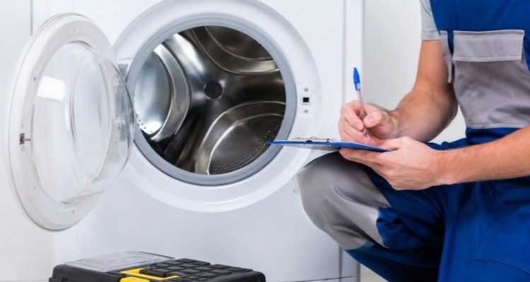 Sparkle Appliance Technician Repairing Dryer