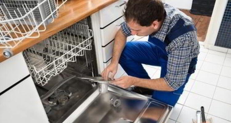 Sparkle Appliance Technician Repairing Kitchen Appliance