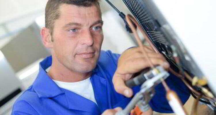 Sparkle Appliance Technician Working On Appliance Repair