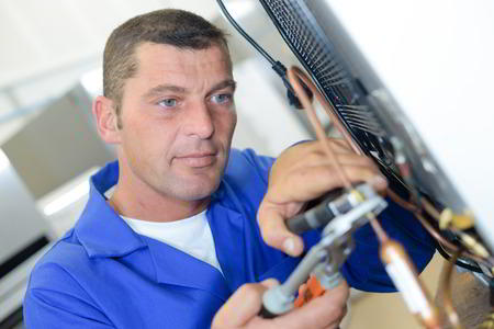 Sparkle Appliance Technician Working On Bloomington Appliance Repair